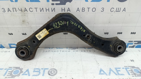 The upper rear left control arm of a Kia Niro 17-22 is rusty.