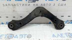 The upper rear left control arm of a Kia Niro 17-22 is rusty.