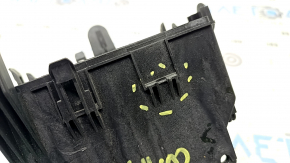 The Jeep Compass 22-26 battery fuse box housing has a broken mount.