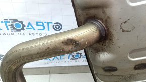 The rear muffler with a barrel for a VW Tiguan 20-24 fwd is dented.