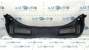 The plastic windshield wiper grille on a Ford Escape MK3 13-19 has broken fasteners.