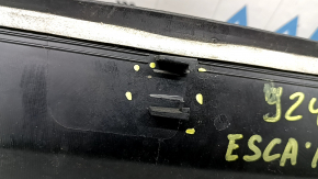 The plastic windshield wiper grille on a Ford Escape MK3 13-19 has broken fasteners.