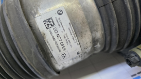 The front left air shock absorber of a BMW 7 G11 G12 16-22 RWD is leaking air.