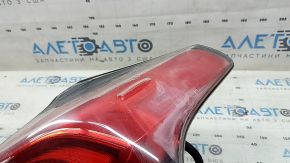 The right outer fender light of a Toyota Rav4 16-18 LED is fogged up.
