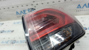 The right outer fender light of a Toyota Rav4 16-18 LED is fogged up.