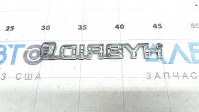Emblem with the inscription "Hybrid" on the front left fender of a Toyota Rav4 16-18