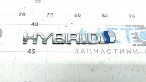 Emblem with the inscription "Hybrid" on the front right fender of a Toyota Rav4 16-18