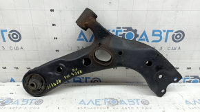 The lower front right control arm of a Toyota Rav4 13-18 is rusty and has microcracks.