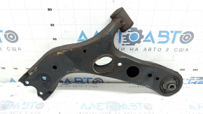 The lower front right control arm of a Toyota Rav4 13-18 is rusty and has microcracks.