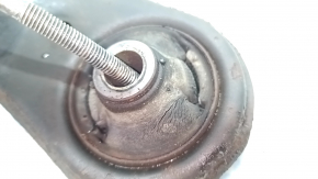 The lower front right control arm of a Toyota Rav4 13-18 is rusty and has microcracks.