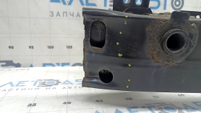 The front bumper reinforcement for a Toyota Rav4 16-18 is rusty and dented.