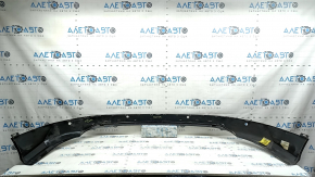 The bare rear bumper, the lower part of the Toyota Rav4 16-18, is structured for parking sensors.