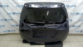 The bare trunk door of a Toyota Rav4 16-18 with electrics and a camera