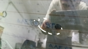 The bare trunk door of a Toyota Rav4 16-18 with electrics and a camera