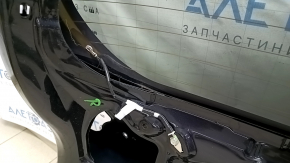 The bare trunk door of a Toyota Rav4 16-18 with electrics and a camera