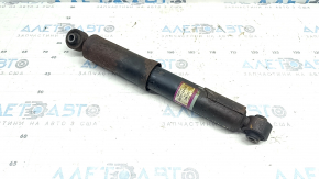 The rear left shock absorber of a 16-18 Toyota Rav4 hybrid is rusty.