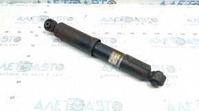 The rear right shock absorber of a 16-18 Toyota Rav4 hybrid is rusty.