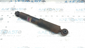 The rear left shock absorber of a 16-18 Toyota Rav4 hybrid is rusty.