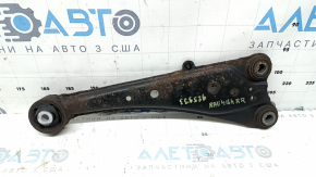 The rear right longitudinal control arm of a Toyota Rav4 13-18 AWD is rusty, the silent block needs replacing.