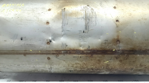 The exhaust pipe, middle section of a 1998 Toyota Rav4 hybrid, is rusty, dented, and has a broken stud.