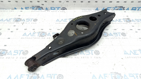 The lower control arm under the rear left spring of a Toyota Rav4 15-18 is rusty, the silent block needs replacing