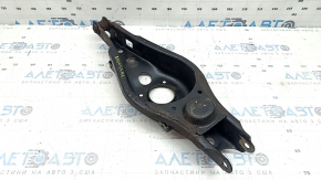 The lower control arm under the rear left spring of a Toyota Rav4 15-18 is rusty, the silent block needs replacing