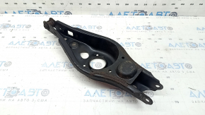 The lower control arm under the rear right spring of a Toyota Rav4 15-18 is rusty, the silent block needs replacing.