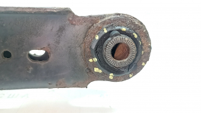 The lower control arm under the rear right spring of a Toyota Rav4 15-18 is rusty, the silent block needs replacing.
