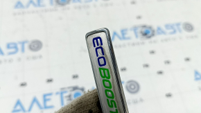 The ECOBOOST AWD emblem on the Ford Edge 19-24 tailgate has peeled off.