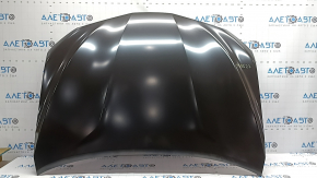 The hood of a Toyota Camry V70 18-24 aluminum is bare. The corner is bent.