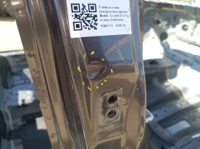 The center right body pillar of a 13-17 Honda Accord has dents on the body.