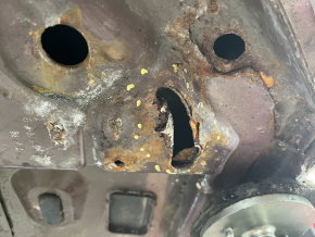 Front left quarter panel of a 19-24 Ford Edge on the body, burgundy, rusty, torn