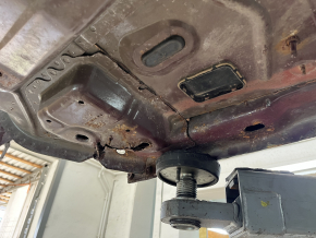 Front right quarter panel of a 19-24 Ford Edge on the body, burgundy, rusty, torn
