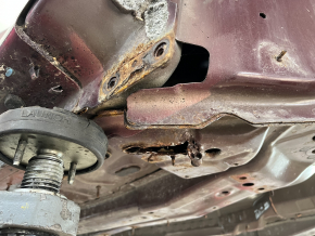 Front right quarter panel of a 19-24 Ford Edge on the body, burgundy, rusty, torn