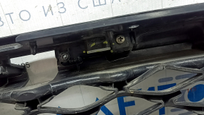 The radiator grille of the Infiniti QX50 19-25 is bare, without the emblem and chrome molding, broken, cracked, and the fasteners are broken.