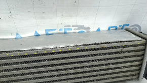 The Infiniti QX50 19-25 intercooler is dented and the mount is broken.