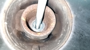 The rear subframe of the Infiniti QX50 19-25 AWD is rusty, with microcracks in the S/B, and a dented ear.