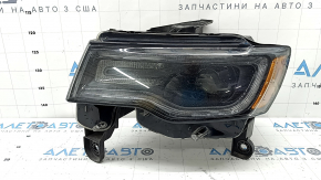 Jeep Grand Cherokee WK2 16-18 xenon front left headlight assembly, dark, no washer, deposits on the inside of the glass