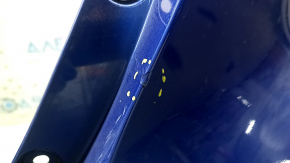 The rear bumper is bare for a Honda Insight 19-22 blue, 593M, dented, cracked, and the mount is broken.