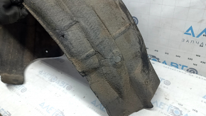 The rear right fender liner of a Honda Insight 19-22 is dented.