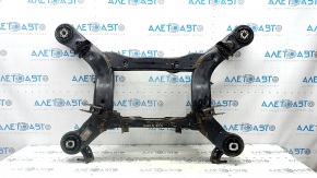The rear subframe of a Jeep Grand Cherokee WK2 16-22 is rusty, and the gearbox bushings are torn.