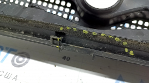 The plastic windshield wiper grille on a 19-22 Honda Insight has a broken mount.