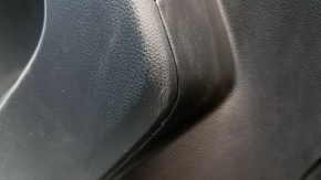 The door trim panel, rear left, Toyota Rav4 19-24, is black, the armrest is black leather, the insert is black plastic, chrome molding, scuffs