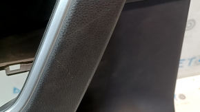 The door trim panel, rear left, Toyota Rav4 19-24, is black, the armrest is black leather, the insert is black plastic, chrome molding, scuffs