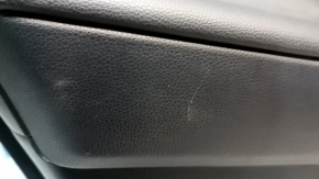 The door trim panel, rear left, Toyota Rav4 19-24, is black, the armrest is black leather, the insert is black plastic, chrome molding, scuffs