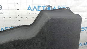 Upper battery trim for a Lincoln MKZ 13-20 hybrid, black, worn, needs dry cleaning, tear