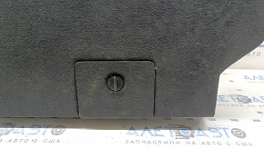 Upper battery trim for a Lincoln MKZ 13-20 hybrid, black, worn, needs dry cleaning, tear