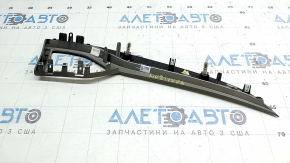 Right front panel trim for a Lincoln MKZ 17-20, gray, brown wood, crack in the mount, chip