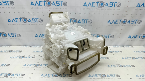 The bare heater housing of a Toyota Venza 21 air conditioning system without radiators and actuators.