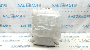The bare heater housing of a Toyota Venza 21 air conditioning system without radiators and actuators.